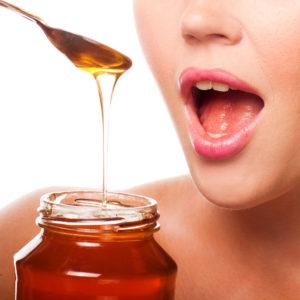 Honey image with woman's face and spoon